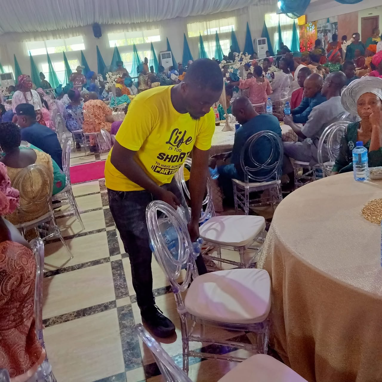 Usher Attending to VIP Guests at High Table
